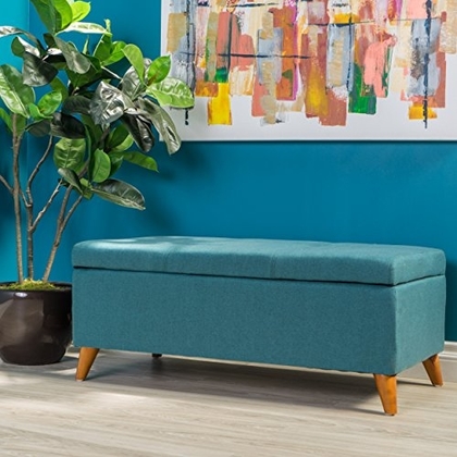 People recommend "GDF Studio Etoney Mid Century Modern Fabric Storage Ottoman (Teal)"